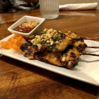 3 Chicken Satay · Marinated beef skewered, topped with peanuts and scallion oil, served with peanut sauce.