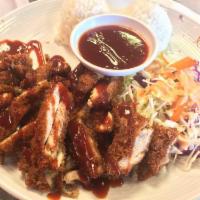 Chicken Katsu · Breaded and fried chicken cutlet topped with our Wok'n Guys katsu sauce. Served with cabbage...