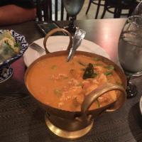 Pumpkin Curry Chicken · Chicken served in red curry with kabacha pumpkin, bell peppers and sweet basil. Medium spicy.