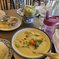 Green Curry · Eggplant, bamboo shoots, bell peppers and basil leaves in Thai green coconut milk curry. Med...