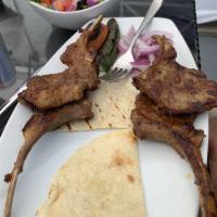 Lamb Chops · Lamb chops char-grilled, served with mixed greens and one side dish.