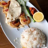 Shrimp Shish Kebab · Jumbo shrimp char-grilled, served with mixed greens and one side dish.