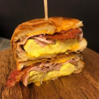 Croissant Sandwich · Comes with egg and cheese. Choice of protein is ham, sausage or bacon.