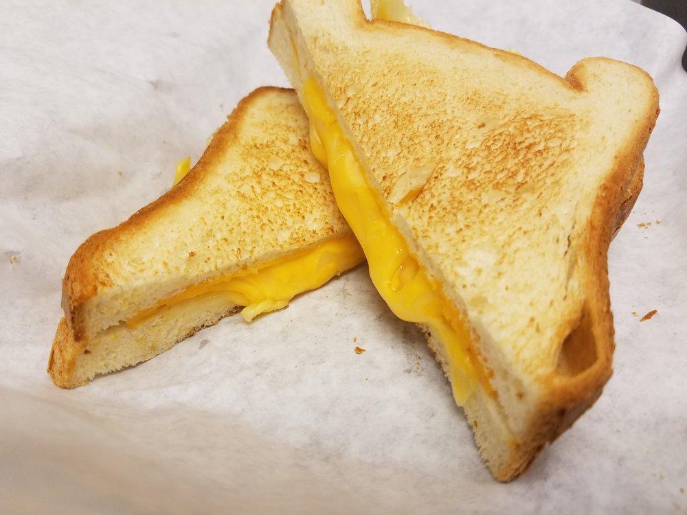 Melted Cheese Sandwich · American and provolone cheese on white bread. Option to add bacon or ham for an additional charge.