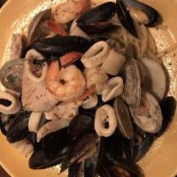 Linguini Seafood Fra Diavolo · Fresh Canadian mussels, jumbo shrimp, littleneck clams, day boat scallops, fresh calamari, a...