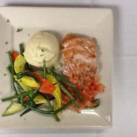 Grilled Salmon · Served with sauteed spinach and mashed potatoes garnished with tomato bruschetta.