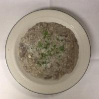Risotto Al Fungi · Arborio rice in a wild mushroom cream sauce with mushrooms finished with grated cheese and f...