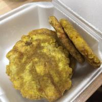 Tostones · Green plantains. Regular order is 6, large is 10.