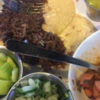 Barbacoa Tacos · Cheek meat marinated to perfection.