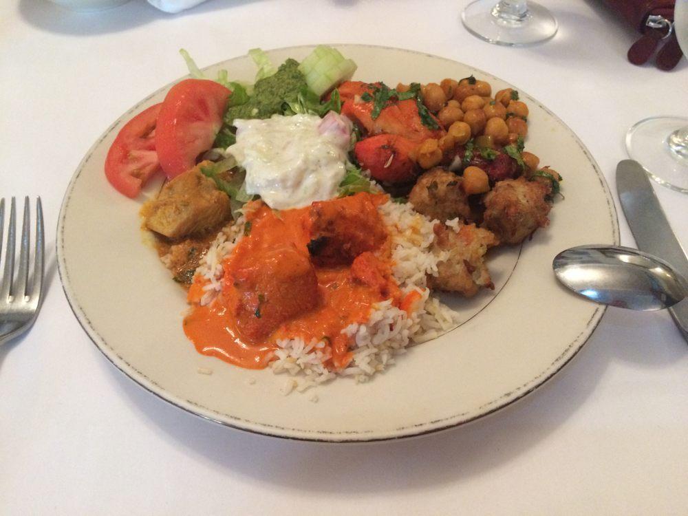 Chana Masala · Chickpeas cooked with fresh tomatoes, onions and herbs in a flavorful sauce. Served with basmati rice.
