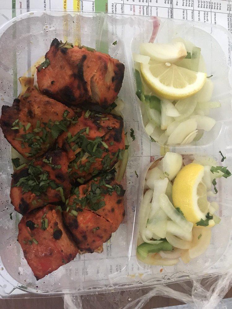 Chicken Tikka · Skewered cubes of chicken breast marinated in yogurt, herbs and spices and baked in the clay oven. Served with saffron basmati rice.