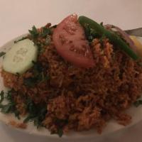 Chicken Biryani · Boneless chicken breast sauteed in herbs and mild spices, cooked with saffron basmati rice, ...