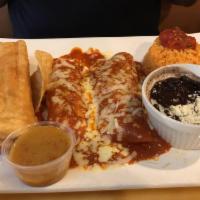 Tamales · 3 chicken tamales topped with cheese and salsa.