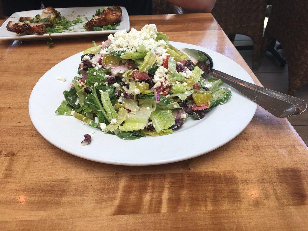 Greek Salad · Romaine, organic spinach, Bibb lettuce, red onion, Kalamata olives, tomatoes, Persian cucumbers, pepperoncini, crumbled feta cheese and house dressing. Vegetarian. Gluten free.