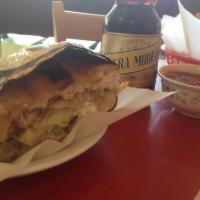 Torta · Mexican sandwich with guacamole, cheese, lettuce, tomato and sour cream.