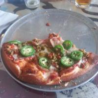 Ring of Fire Pizza · Hot Italian sausage, red chili flake, green chile, jalapenos, and red chili oil.