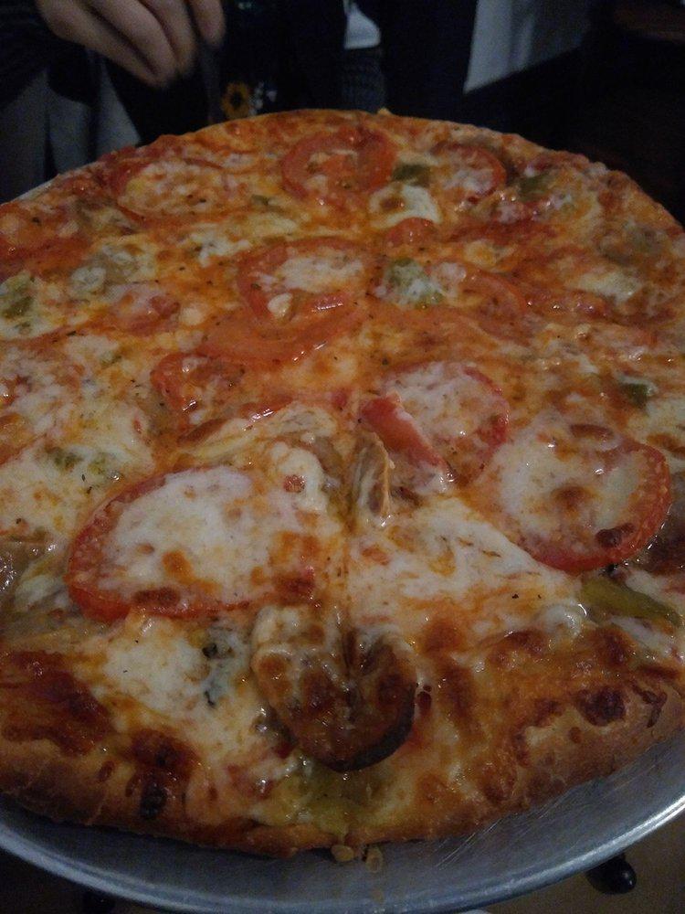 Parlor Pie · Green chile, Italian sausage, extra cheese and fresh Roma tomatoes.