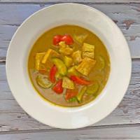 Indian Curry Tofu · Tofu, potato, zucchini, peas, carrots, and red bell pepper in Indian yellow curry spice mixe...