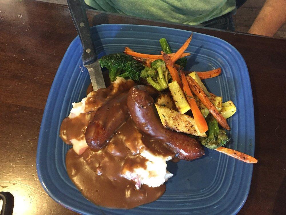 Bangers and Mash · 2 pork banger sausages served with mashed potatoes, beef gravy and seasonal vegetables.