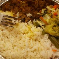 Curry Goat · Delicious Caribbean style curry goat serve with any side of your choice.