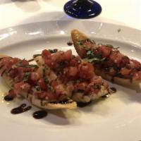 Bruschetta · Fresh tomato, garlic, basil served on house baked bread, drizzled with balsamic vinegar and ...