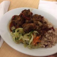 Brown Stew Chicken Dinner · Served with your choice of rice with peas, cabbage or salad.