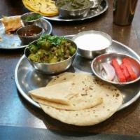 Bhindi · Seasoned okra sauteed with onions, tomatoes and onions.