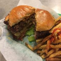 The Juicy Lucy Burger · 10oz. patty stuffed with giardinerra and chihuahua cheese with lettuce, tomato and a kosher ...