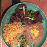 Carne Asada · Thin slices of skirt steak cooked over charcoal. Served with pico de gallo, guacamole, rice,...