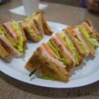 Turkey Club Sandwich · Mayo, lettuce, tomato, bacon, ham, turkey.
