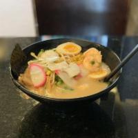 Seafood Ramen · Shrimp, scallop, fish cake, boiled egg, bamboo shoots, corn, green onion, sprouts.