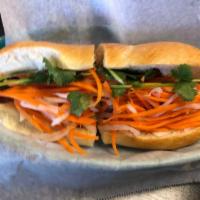Grilled Pork Sandwich · Banh mi thit nuong. Marinated pork slices in a hoagie with mayo spread, pickled carrots and ...