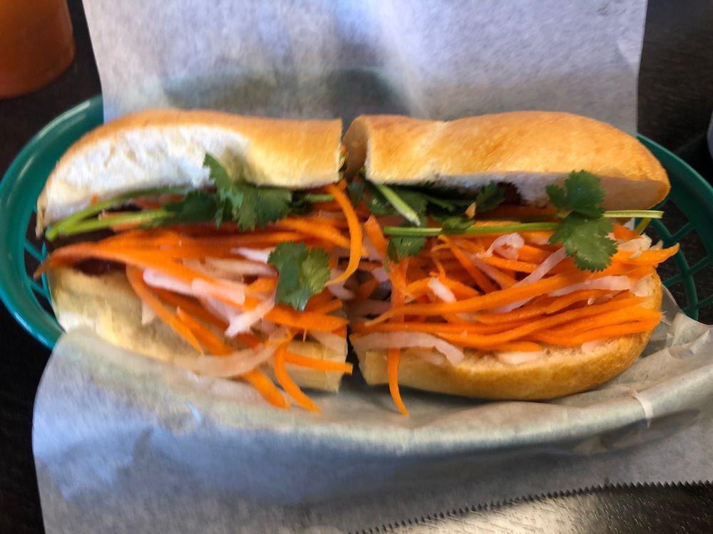 Grilled Pork Sandwich · Banh mi thit nuong. Marinated pork slices in a hoagie with mayo spread, pickled carrots and daikon, cucumber, cilantro and jalapeno peppers.