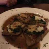 Veal Saltimbocca · Lightly sauteed in seasoned flour topped with prosciutto, sauteed spinach, dusted with sage ...