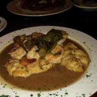 Chicken Italiano · Sauteed shrimp in a garlic and olive oil sauce and garnished with long hots.