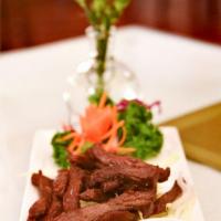 Beef Jerky · Crispy fried marinated beef served with chili sauce.