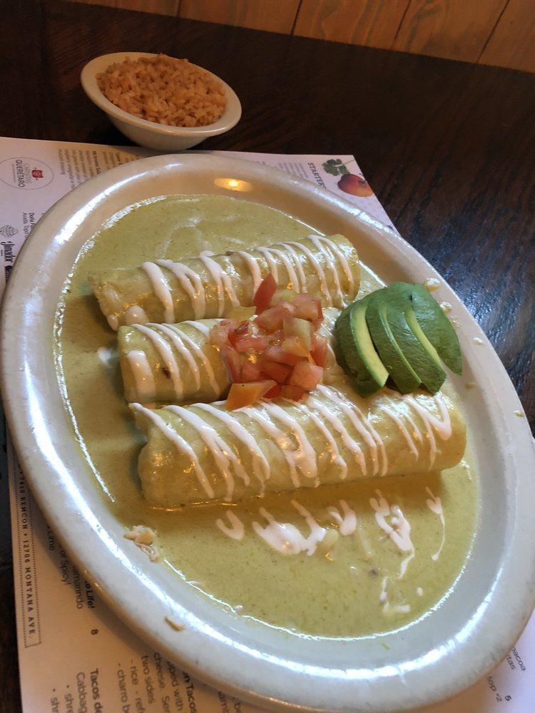 Enchiladas Suizas · 3 rolled chicken enchiladas with creamy tomatillo sauce topped with sour cream and avocado. Choice of 1 side.