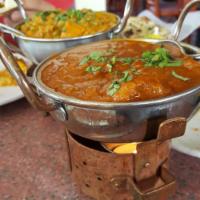 Lamb Vindaloo · Boneless lamb pieces cooked with potatoes and tangy spicy sauce.