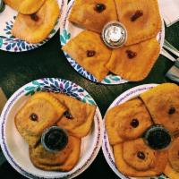 Jamaican Patties · Beef or curry chicken. Freshly baked, golden crusted, mouth-watering, world famous, island s...