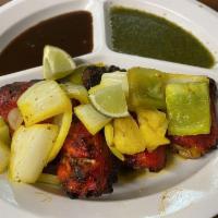 Tandoori Chicken · ** Requires 20 Minutes of Prep Time** Clay oven roasted chicken traditionally marinated in y...