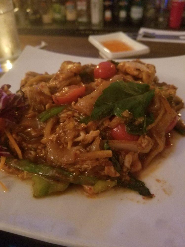 Drunken Noodle · Broad noodles, rice wine vinegar egg,  onion, bell pepper, tomato, bamboo shoot and basil. Your choice of protein. Hot and spicy. Vegetarian options available.
