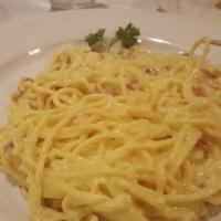 Spaghetti Carbonara · Served in cream sauce with bacon and onions.