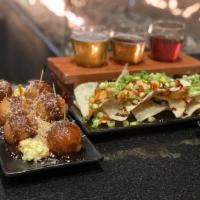 Takoyaki · Battered octopus over egg tartar topped with mayonnaise, okonomiyaki sauce, ao-nori and smok...
