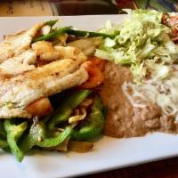 Fajitas · Choice of steak, strips of chicken or pieces of Tilapia fish, cooked with onions, tomatoes a...