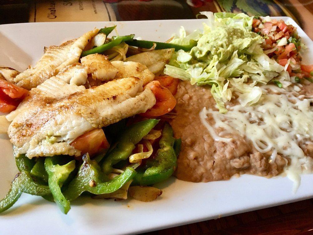 Fajitas · Choice of steak, strips of chicken or pieces of Tilapia fish, cooked with onions, tomatoes and bell peppers. Served with rice, beans, guacamole salad, sour cream and pico de gallo.