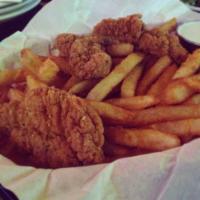 Chicken Strips · Juicy fried chicken strips served with fries.
