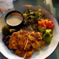 Nola Chicken Bowl · Two grilled cajun seasoned chicken breasts, roasted broccoli, avocado, diced tomato, marinat...