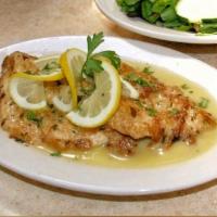 Chicken Francese · Filet of chicken sauteed in an egg batter with a lemon and white wine sauce, served with sid...