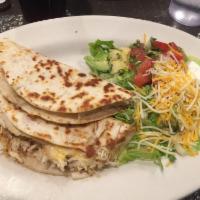 Quesadilla · Freshly made tortilla stuffed with chicken and cheese, or cheese only.