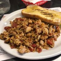 Chicken Jambalaya · Spicy. Served with 1 fixin and grilled sourdough bread.